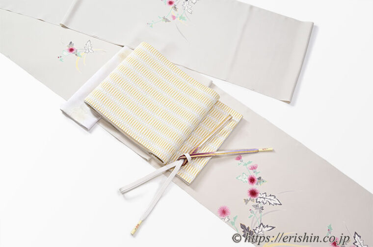 コーディネート例「湯本エリ子さんの薊の付下に北村武資さんの繧繝錦の袋帯」