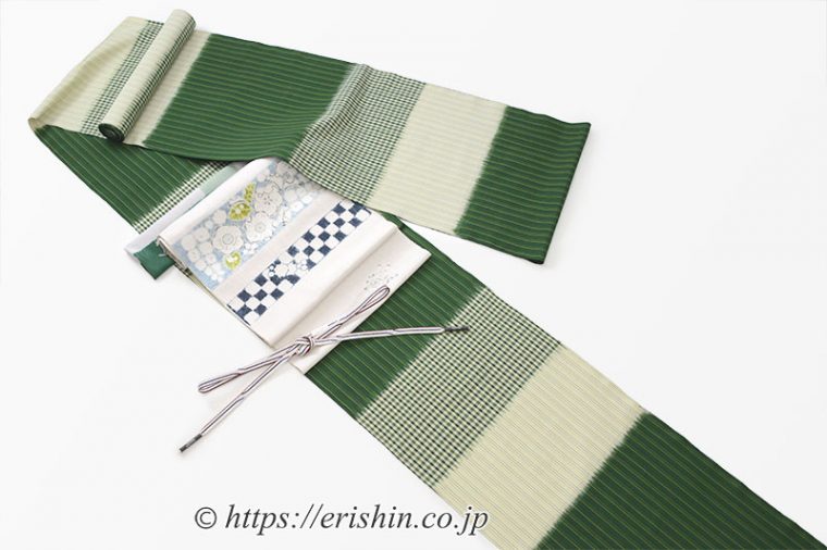 芝崎圭一作座繰り紬に森健持作の辻ヶ花染め名古屋帯