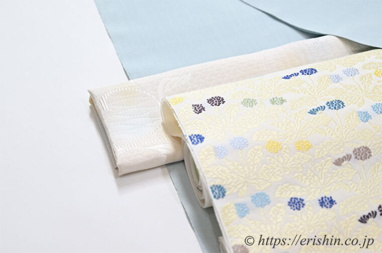 旬のお勧めコーディネート「芝崎圭一 座繰り紬無地に勝山さと子 蒲公英の名古屋帯」