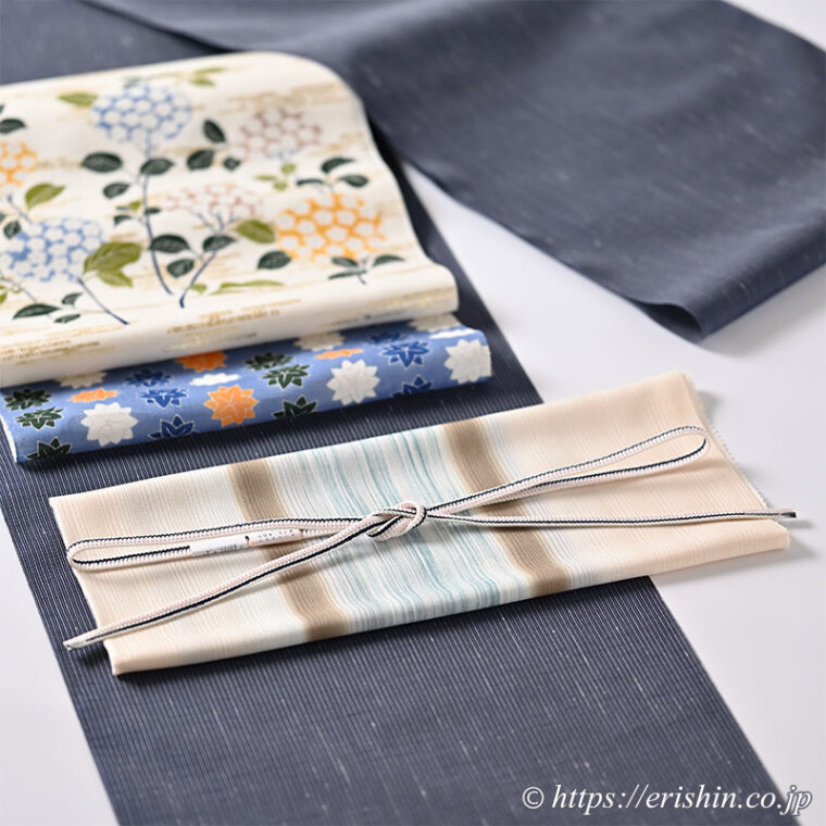 帯締め 源氏立別レース組（ミシン房/鉄紺色×薄桜色）[夏・単衣向]と 帯揚げ（横段しけ暈し/鳥の子色に茶と青・乱絽）[夏・単衣向]