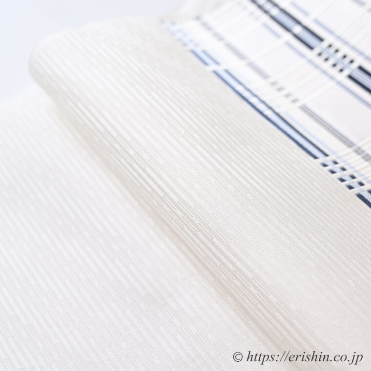 美術工芸 啓　九寸織名古屋帯（錦熨斗目/深縹色を中心に水色を添えて）