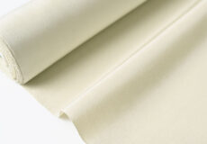 芝崎圭一　座繰紬（無地/淡い裏柳色）「着物と帯・呉服えり新」